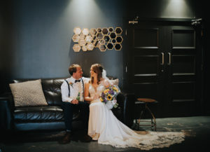 Kirsty & Ben on sofas at New Craven Hall